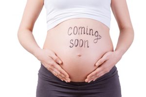 'Pregnant Stomach with 'Coming Soon Written' on it'